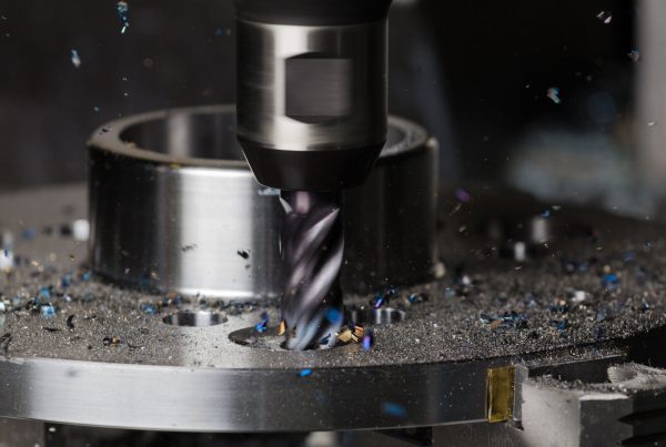A hole is milled in a flange on a CNC machining center