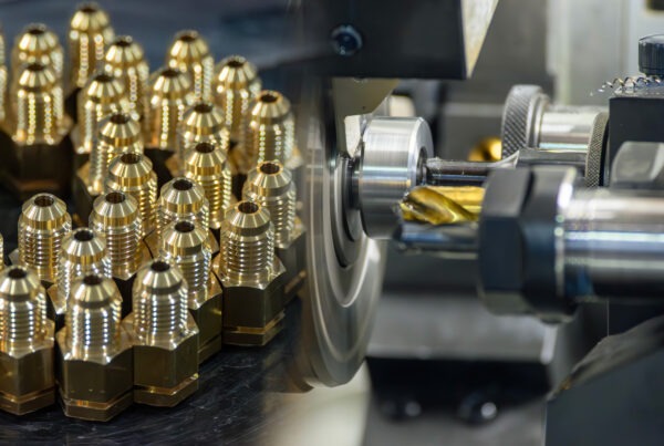 Metal machining multi tasking CNC lathe machine and the group of brass male fitting connector parts.